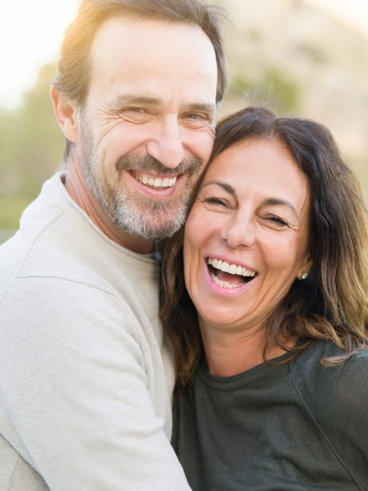 Smiling couple on the teeth grinding information page